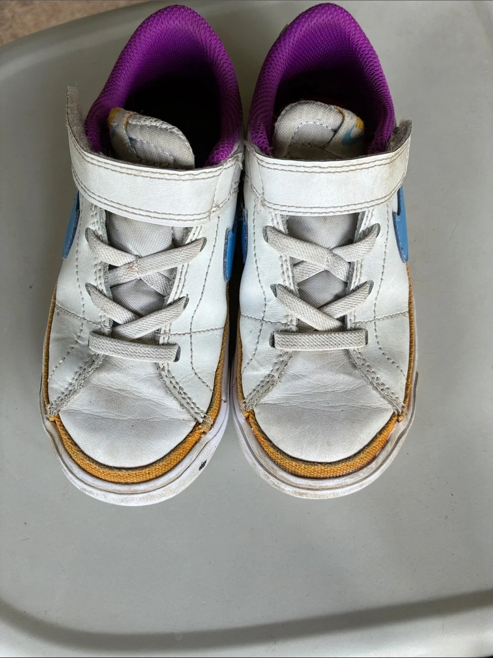 Nike Kids White Sneakers with Purple Lining and Blue Accent
